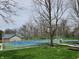 Well-maintained tennis court and adjacent basketball court for recreation at 3636 Woodglen Way, Anderson, IN 46011