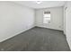 Neutral bedroom with carpeted floors, a single window, and ample space at 4140 Congaree Dr, Indianapolis, IN 46235