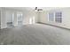 Bright, spacious bedroom with new carpet, a ceiling fan and large windows at 4140 Congaree Dr, Indianapolis, IN 46235