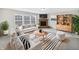 Bright living room with fireplace, hardwood floors, and large windows at 4140 Congaree Dr, Indianapolis, IN 46235