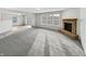 Bright open-concept space with a corner fireplace and a patio door at 4140 Congaree Dr, Indianapolis, IN 46235