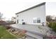 A backyard with a deck on a home with light gray vinyl siding and a sliding glass door at 436 N Shore Ct, Franklin, IN 46131