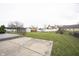 A spacious backyard features a concrete pad and a large grassy lawn at 436 N Shore Ct, Franklin, IN 46131