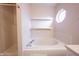 Bathroom with shelves and tub with tiled walls at 436 N Shore Ct, Franklin, IN 46131