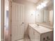 Well-lit bathroom featuring a white vanity, ample countertop space, a large mirror, and essential fixtures at 436 N Shore Ct, Franklin, IN 46131