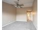 Neutral bedroom with ceiling fan and bathroom with double sinks and shower in view at 436 N Shore Ct, Franklin, IN 46131