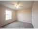 Comfortable bedroom with neutral walls, a ceiling fan, a window, and carpeted floors at 436 N Shore Ct, Franklin, IN 46131