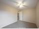 Standard bedroom featuring neutral walls, carpeted floors, and a doorway leading to an adjacent room at 436 N Shore Ct, Franklin, IN 46131