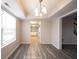 Open dining room with hardwood floors, modern lighting, and seamless flow to other rooms at 436 N Shore Ct, Franklin, IN 46131