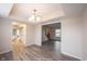Open dining room with hardwood floors, modern lighting, and seamless flow to other rooms at 436 N Shore Ct, Franklin, IN 46131