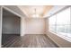 Bright dining room with hardwood floors and abundant natural light from the large window at 436 N Shore Ct, Franklin, IN 46131