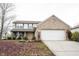 Charming two-story home with a brick facade and attached two-car garage on a lot covered with leaves at 436 N Shore Ct, Franklin, IN 46131