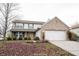 Charming two-story home with a brick facade and attached two-car garage on a lot covered with leaves at 436 N Shore Ct, Franklin, IN 46131