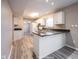 Bright kitchen with white cabinets, stainless steel appliances and tile flooring at 436 N Shore Ct, Franklin, IN 46131