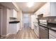 Bright kitchen with white cabinets, stainless steel appliances and tile flooring at 436 N Shore Ct, Franklin, IN 46131