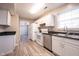Bright kitchen with white cabinets, stainless steel appliances and tile flooring at 436 N Shore Ct, Franklin, IN 46131