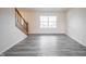 Bright living room featuring hardwood floors, large window and staircase at 436 N Shore Ct, Franklin, IN 46131