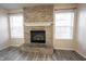Living room features a brick fireplace with white mantle and windows at 436 N Shore Ct, Franklin, IN 46131