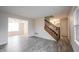 Open-concept living room showcasing hardwood floors, seamless transition to dining and stairway at 436 N Shore Ct, Franklin, IN 46131