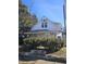 Charming home featuring a screened porch and mature landscaping at 439 N Colorado Ave, Indianapolis, IN 46201