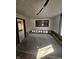 Room featuring carpeted flooring, white walls, and a large window at 439 N Colorado Ave, Indianapolis, IN 46201
