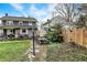 Landscaped backyard with a patio set, lush greenery, and partial lawn view at 4517 Central Ave, Indianapolis, IN 46205