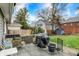 Private backyard featuring a built-in grill, patio area, shed, and lush lawn space at 4517 Central Ave, Indianapolis, IN 46205