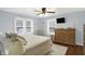 Spacious bedroom with ceiling fan, natural light, and a dresser at 4517 Central Ave, Indianapolis, IN 46205