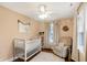 Charming Bedroom with crib, glider, natural light, and decor at 4517 Central Ave, Indianapolis, IN 46205