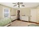 Bright bedroom includes matching dressers and a glimpse into an organized closet at 4517 Central Ave, Indianapolis, IN 46205
