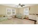 Inviting bedroom features twin beds, bright windows, and a neutral rug, perfect for  at 4517 Central Ave, Indianapolis, IN 46205