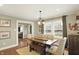 Bright dining area with wood floors, rustic furniture, and stylish decor at 4517 Central Ave, Indianapolis, IN 46205