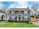Charming two-story home featuring a well-maintained lawn and classic architectural details at 4517 Central Ave, Indianapolis, IN 46205