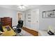 Office space featuring hardwood floors, a functional desk, and comfortable seating at 4517 Central Ave, Indianapolis, IN 46205