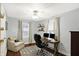 Comfortable home office with natural light, desk setup, and cozy seating area at 4517 Central Ave, Indianapolis, IN 46205