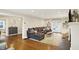 Spacious living room with dark wood floors, a fireplace, and a comfortable sectional at 4517 Central Ave, Indianapolis, IN 46205