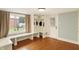 Bright mudroom featuring built-in storage, bench, and window overlooking the backyard at 4517 Central Ave, Indianapolis, IN 46205