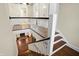 Staircase with dark wood treads and white risers, leading to second story at 4517 Central Ave, Indianapolis, IN 46205