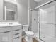 Clean bathroom with vanity, toilet, and glass door shower at 5003 Lilium Dr, Plainfield, IN 46168