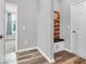 Stylish entryway with coat rack, bench, and wood-look flooring at 5003 Lilium Dr, Plainfield, IN 46168
