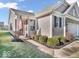 Charming home exterior with manicured lawn, stone accents, and a two-car garage at 5003 Lilium Dr, Plainfield, IN 46168