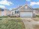 Charming single-Gathering home with a two-car garage and well-manicured lawn at 5003 Lilium Dr, Plainfield, IN 46168