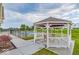 Charming gazebo overlooking the pool area, providing a shaded spot for relaxation and social gatherings at 5003 Lilium Dr, Plainfield, IN 46168