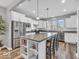 Modern kitchen with white cabinets, stainless steel appliances, and a center island at 5003 Lilium Dr, Plainfield, IN 46168