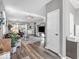 Bright living room featuring wood floors, ceiling fan, and comfortable seating area at 5003 Lilium Dr, Plainfield, IN 46168