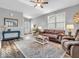 Cozy living room with plush seating, area rug, and abundant natural light at 5003 Lilium Dr, Plainfield, IN 46168