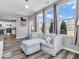Inviting living room with modern decor, large windows, and a seamless flow to the kitchen at 5003 Lilium Dr, Plainfield, IN 46168