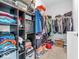Organized walk-in closet with shelving and hanging racks at 5003 Lilium Dr, Plainfield, IN 46168