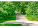 Picturesque walking trail surrounded by lush greenery, offering a serene environment for outdoor activities at 5003 Lilium Dr, Plainfield, IN 46168