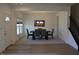 Open concept dining room featuring elegant lighting and room for six at 5303 Rum Cherry Way, Indianapolis, IN 46237